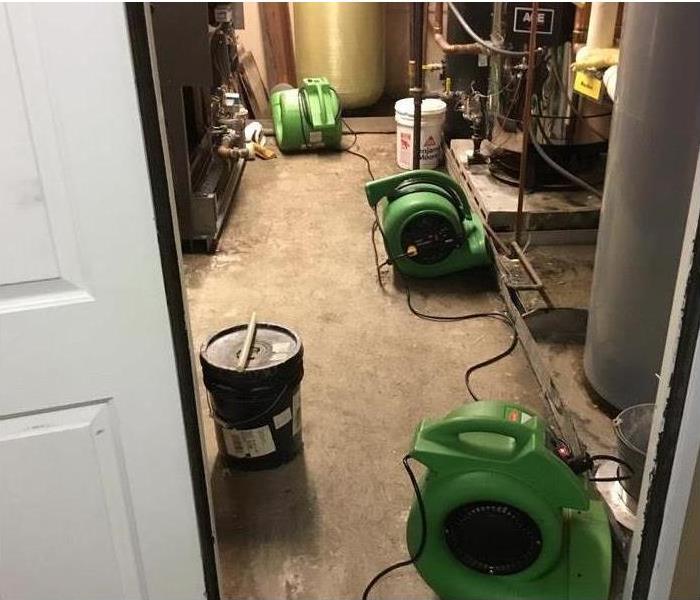 Green Air Movers drying a Commercial Utility Room