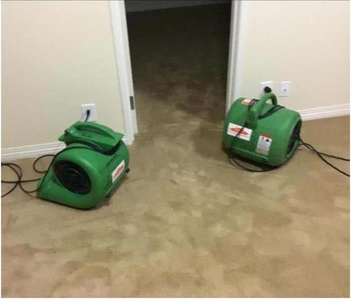 Air Movers Drying out Wet Carpet